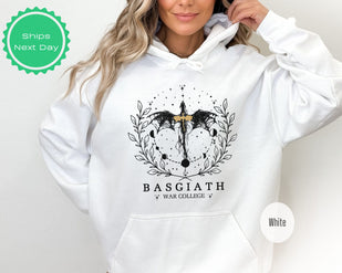 a woman wearing a white hoodie with a black and white graphic on it